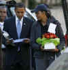 Michelle and Barack Obama talk after parent teacher meetings at their daughter's Chicago school on November 7, 2008.