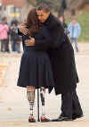 Obama hugs Iraq war veteran and friend in Chicago on Veterans Day, November 11, 2001.