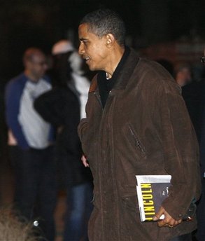 Obama with newly released Lincoln book. President-Elect Obama leaves a friend's house for his motorcade in Chicago on 11/22/08.