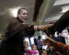 Barack Obama meets school children and teachers. The Obama family makes a surprise visit to a Chicago Parish and School on November 26, 2008.