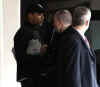 The Secret Service keeps a close watch on Barack Obama as he leaves Chicago gym on November 9, 2008.