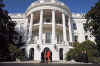 George and Laura Bush stand with Barack and Michelle Obama at the South Portico of the White House on November 10, 2008.