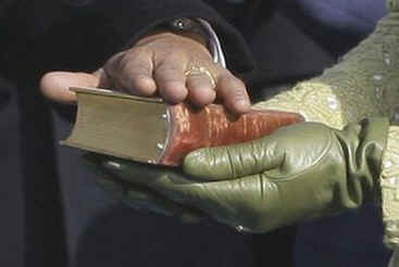 On November 20, 2009 Michelle Obama holds Lincoln's Bible as Barack Obama is sworn in as President.