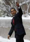 Barack Obama waves as he leaves the University of Chicago Laboratory Schools after attending a school party for his two daughter's last day at school.