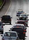 Barack Obama's motorcade on the way to December 23, 2008 memorial services in Honolulu church for Obama's maternal grandmother Madelyn Dunham who died near the end of Obama's 2008 presidential bid.