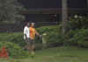 Barack Obama walks with family friend Eric Whitaker at Obama's vacation beach house on December 27, 2008.