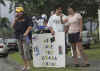 Barack Obama supporters hold We Love You sign outside Barack Obama's family vacation compound in Hawaii on December 30, 2008.