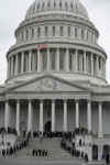 Military personnel on the East Front steps of the Capitol Building are used as stand-ins for Barack and Michelle Obama in a full dress rehearsal of the 56th inauguration.