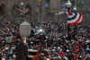 Obama delivers a speech to thousands of supporters in Baltimore. Barack and Michelle Obama, and Joe and Jill Biden, arrive via train in Baltimore. Obama gives a speech at the Baltimore City Hall in the War Memorial Plaza and then continues his journey to Washington and his temporary residence at Blair House. Michele Obama celebrated her 45th birthday on January 17, 2009. Michele Obama was presented a birthday cake on the train.