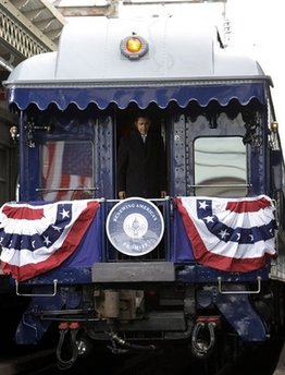 Barack Obama takes the same train journey as President Abraham Lincoln from Philadelphia to Washington on a 137 mile whistle stop trip. Obama's train, known as the Obama Express, stopped in Wilmington, Delaware to pick up Joe Biden, and a stop in Baltimore where he delivered another speech. Abraham Lincoln delivered over 100 speeches on his 1861 train journey.