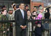 President Obama poses with military personnel at Andrews Air Force Base.