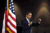 President Barack Obama is welcomed to the stage of the Harborside Event Center in Fort Meyers, Florida by Florida Governor Charlie Crist on February 10, 2009. President Obama spoke to the crowd then answered questions.