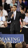 President Barack Obama is welcomed to the stage of the Harborside Event Center in Fort Meyers, Florida by Florida Governor Charlie Crist on February 10, 2009. President Obama spoke to the crowd then answered questions.