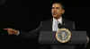 President Barack Obama is welcomed to the stage of the Harborside Event Center in Fort Meyers, Florida by Florida Governor Charlie Crist on February 10, 2009. President Obama spoke to the crowd then answered questions.