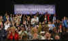 President Barack Obama is welcomed to the stage of the Harborside Event Center in Fort Meyers, Florida by Florida Governor Charlie Crist on February 10, 2009. President Obama spoke to the crowd then answered questions.