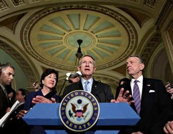 Senate Majority Leader Harry Reid holds a press conference to announce the passing of a $798 billion dollar economic recovery package.