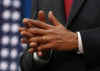 President Obama waits as Vice President Biden speaks at the Denver Museum of Science and Nature before signing stimulus bill.