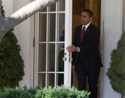 President Barack Obama leaves the Oval Office to board Marine One enroute to Air Force One for a trip to Denver, Colorado to sign the economic stimulus package.