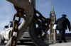 Security preparations continue on Parliament Hill in Ottawa just 48 hours before President Barack Obama's visit to Canada. RCMP and US Secret Service prepare to secure the Parliament grounds, including the installation of concealment tarps, bullet-proof plexi-glass, and street and pedestrian barriers (photo).