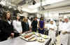 First Lady Michelle Obama meets with White House Executive Chef Cristeta Comerford and the White House kitchen staff to preview the meals for the Governors Dinner in the State Dining Room later that evening. 