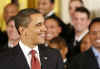 President Barack Obama presents the Commander In Chief Trophy to the Naval Academy Football Team in the East Room of the White House.