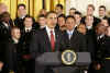 President Barack Obama presents the Commander In Chief Trophy to the Naval Academy Football Team in the East Room of the White House.