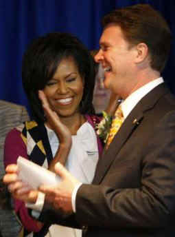 First Lady Obama visits the Office of Personnel Management to watch the official swearing in ceremony of OP Director John Berry.