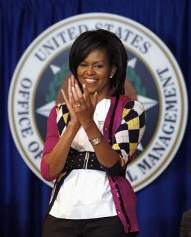 First Lady Obama visits the Office of Personnel Management to watch the official swearing in ceremony of OP Director John Berry.