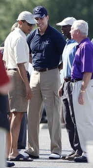 President Barack Obama takes advantage of the warm summer like weather to play his first round of golf since becoming US President.