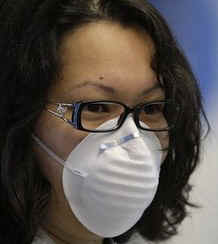 Family member waits at San Francisco airport for her mother returning from Mexico City.