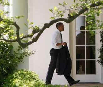 After greeting guests at the ceremony President Obama,  followed by White House aides, walked across the South Lawn to the Oval Office.