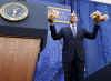 President Obama is introduced by FBI Director Robert Mueller who gives Obama two teddy bears for daughters Sasha and Malia.