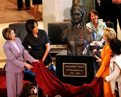 First Lady Michelle Obama, Secretary of State Hillary Clinton, Speaker of the House Nancy Pelosi and other guests join in an unveiling ceremony of the sculpted bust of Sojourner Truth.