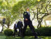 President Barack Obama arrives at a Teacher of the Year ceremony with Education Secretary Arne Duncan and Award Winner Anthony Mullen in the Rose Garden of the White House on April 28, 2009.