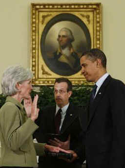 President Barack Obama joins the swearing in ceremony of Kathleen Sebelius as the new Secretary of Health and Human Services in the Oval Office of the White House on April 28, 2009. 