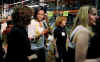 First Lady Michelle Obama and Second Lady Jill Biden join spouses of Members of Congress and other volunteers at a Capital Area Food Bank.