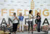 First Lady Michelle Obama and Second Lady Jill Biden join spouses of Members of Congress and other volunteers at a Capital Area Food Bank.