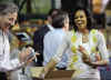 First Lady Michelle Obama and Second Lady Jill Biden join spouses of Members of Congress and other volunteers at a Capital Area Food Bank.