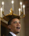 President Barack Obama speaks on the auto industry in the Grand Foyer of the White House on April 30, 2009.