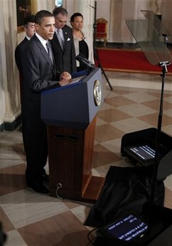 President Barack Obama speaks on the auto industry in the Grand Foyer of the White House on April 30, 2009.