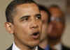 President Barack Obama speaks on the auto industry in the Grand Foyer of the White House on April 30, 2009.