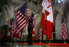 Canadian and American flags are alternately placed down the Hall of Honour in Parliament Hill on February 18, 2009.